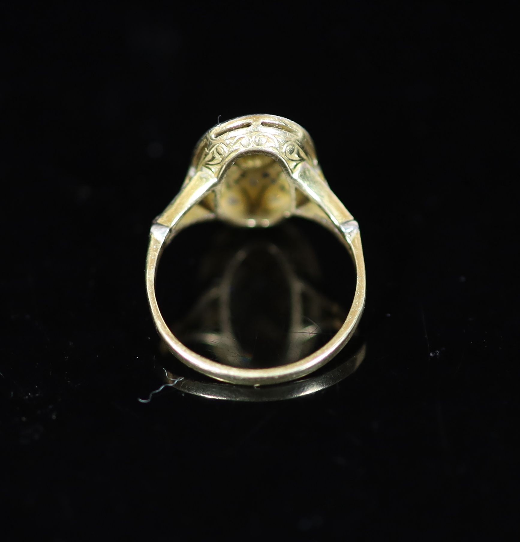 A 1920's gold and platinum, sapphire and diamond millegrain set pierced oval dress ring